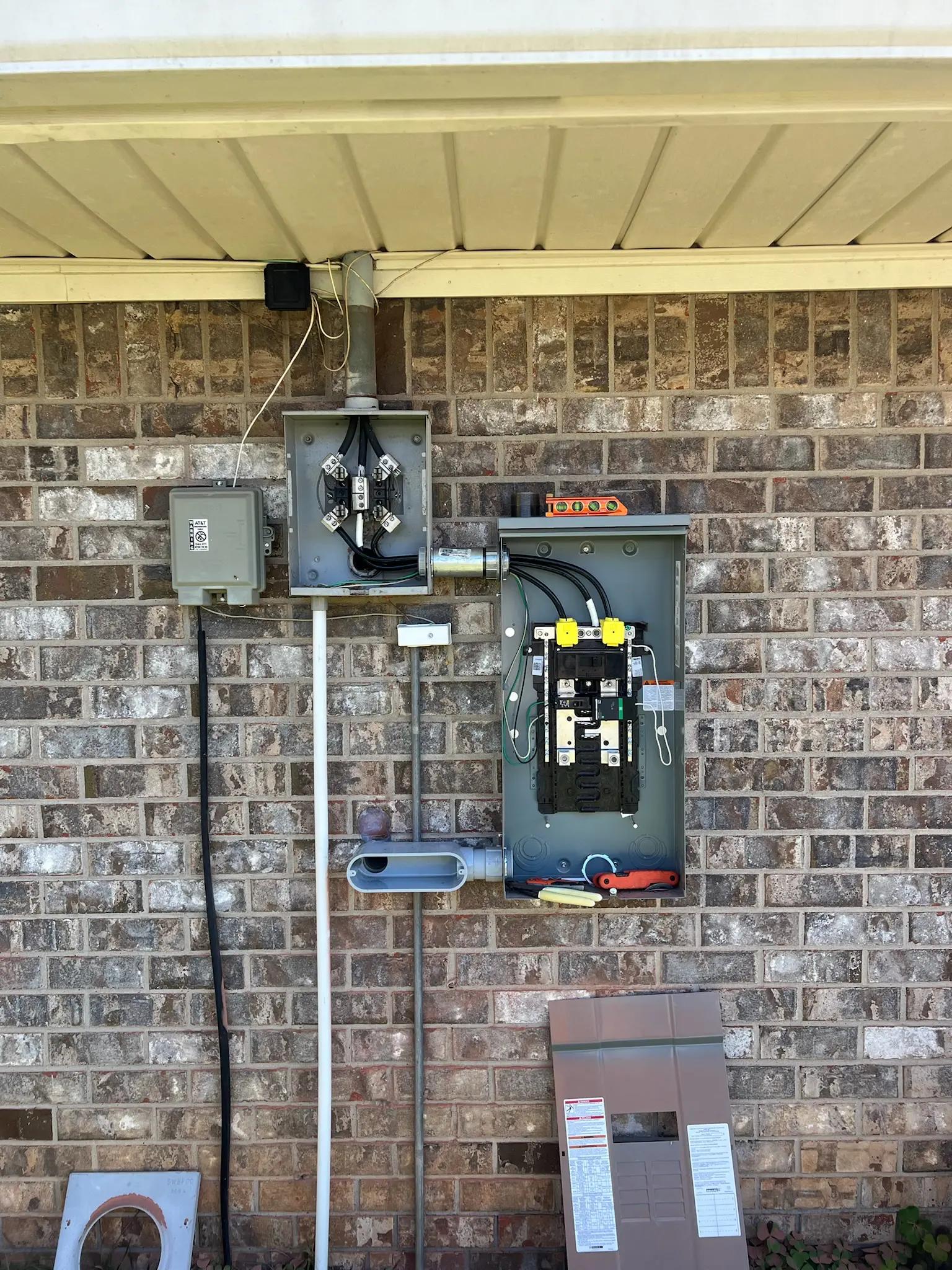 New electrical service meter and disconnect installed on a brick home by Chosen 1 Electric