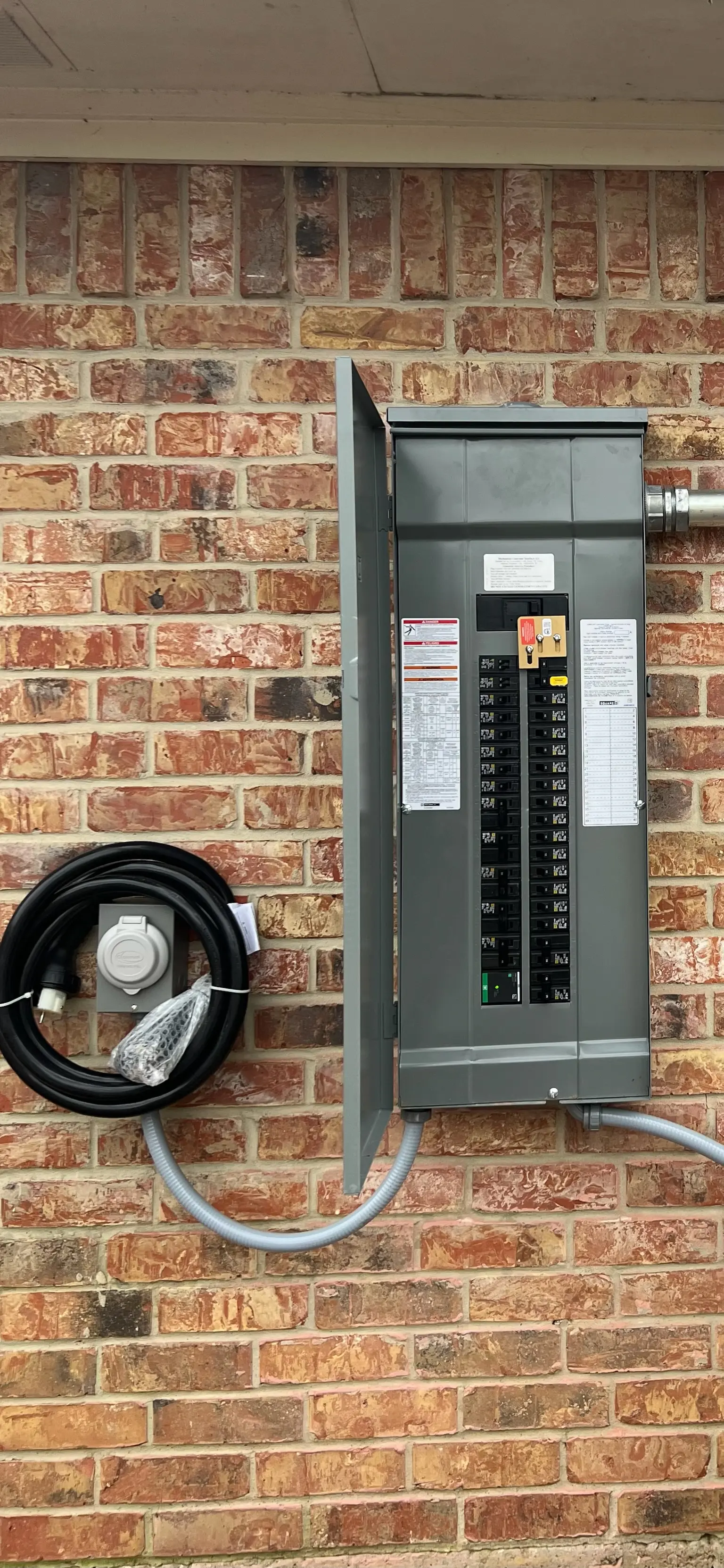 Panel upgrade on the brick exterior of a home by Chosen 1 Electric
