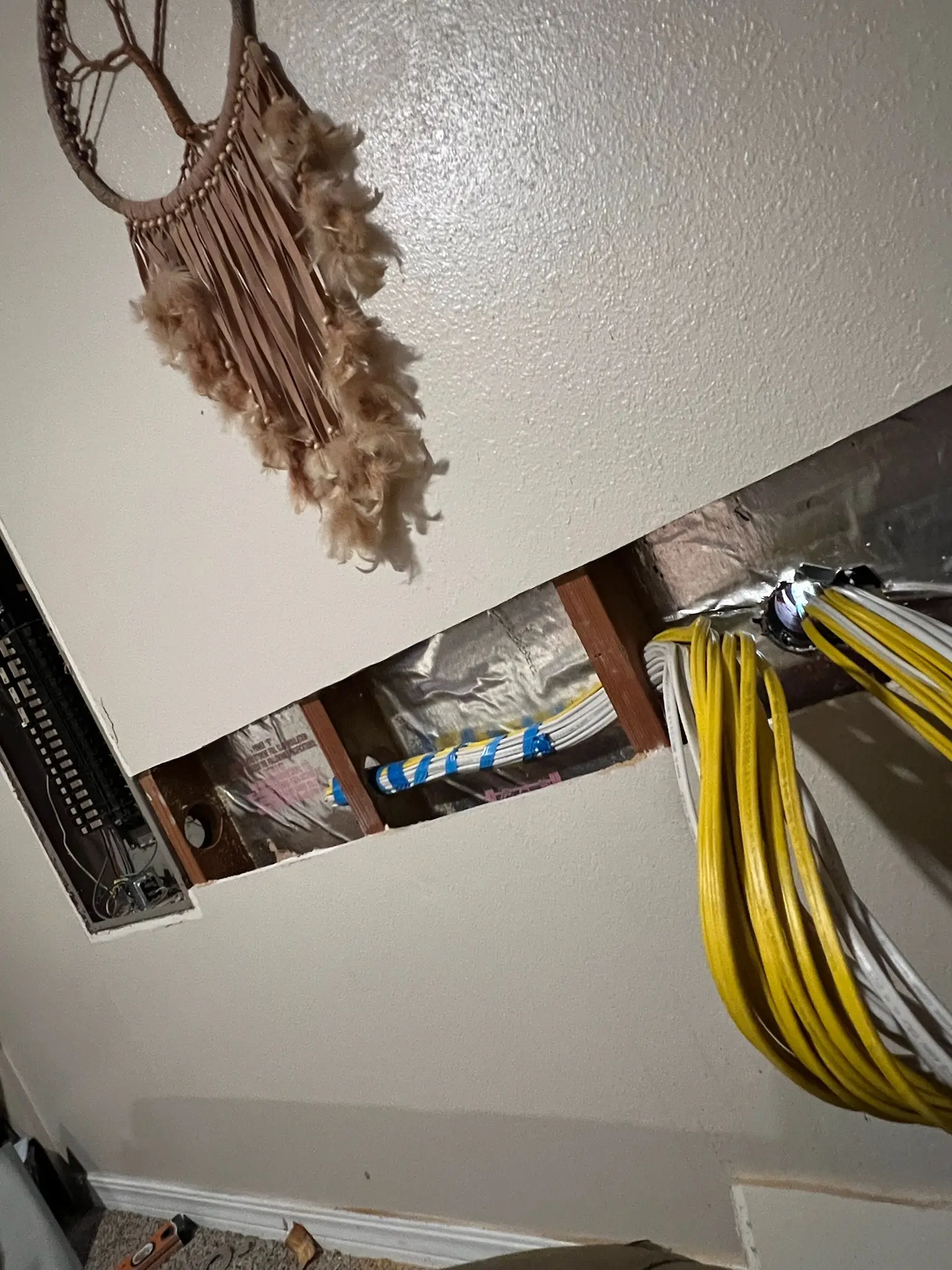 Wire pull during a whole-home rewire performed by Chosen 1 Electric in Houston